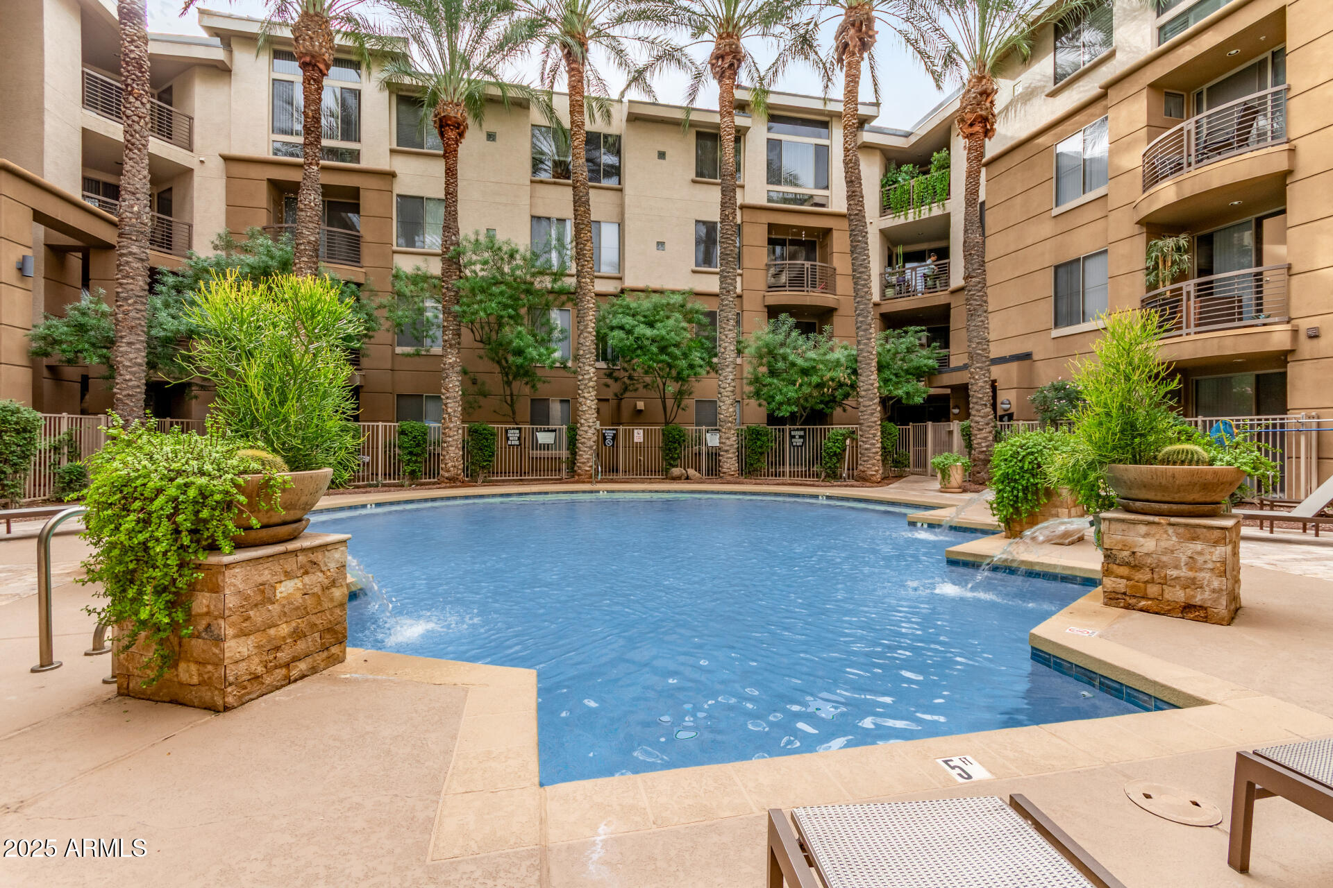a view of a building with potted plants