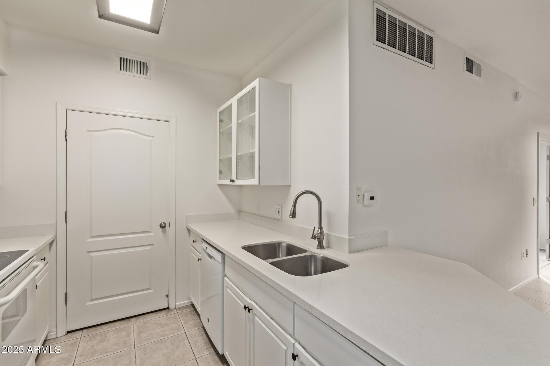 1701 East Colter Street, Unit 191 Phoenix, AZ 85016 - Photo 13 of 33 a kitchen with a sink and cabinets