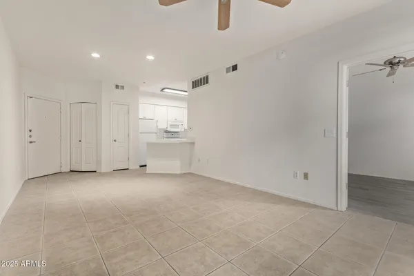 a view of a kitchen with a dishwasher and a refrigerator