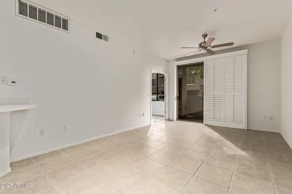 a view of an empty room with a bathroom