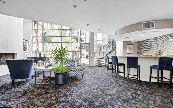 a room with furniture and a potted plant