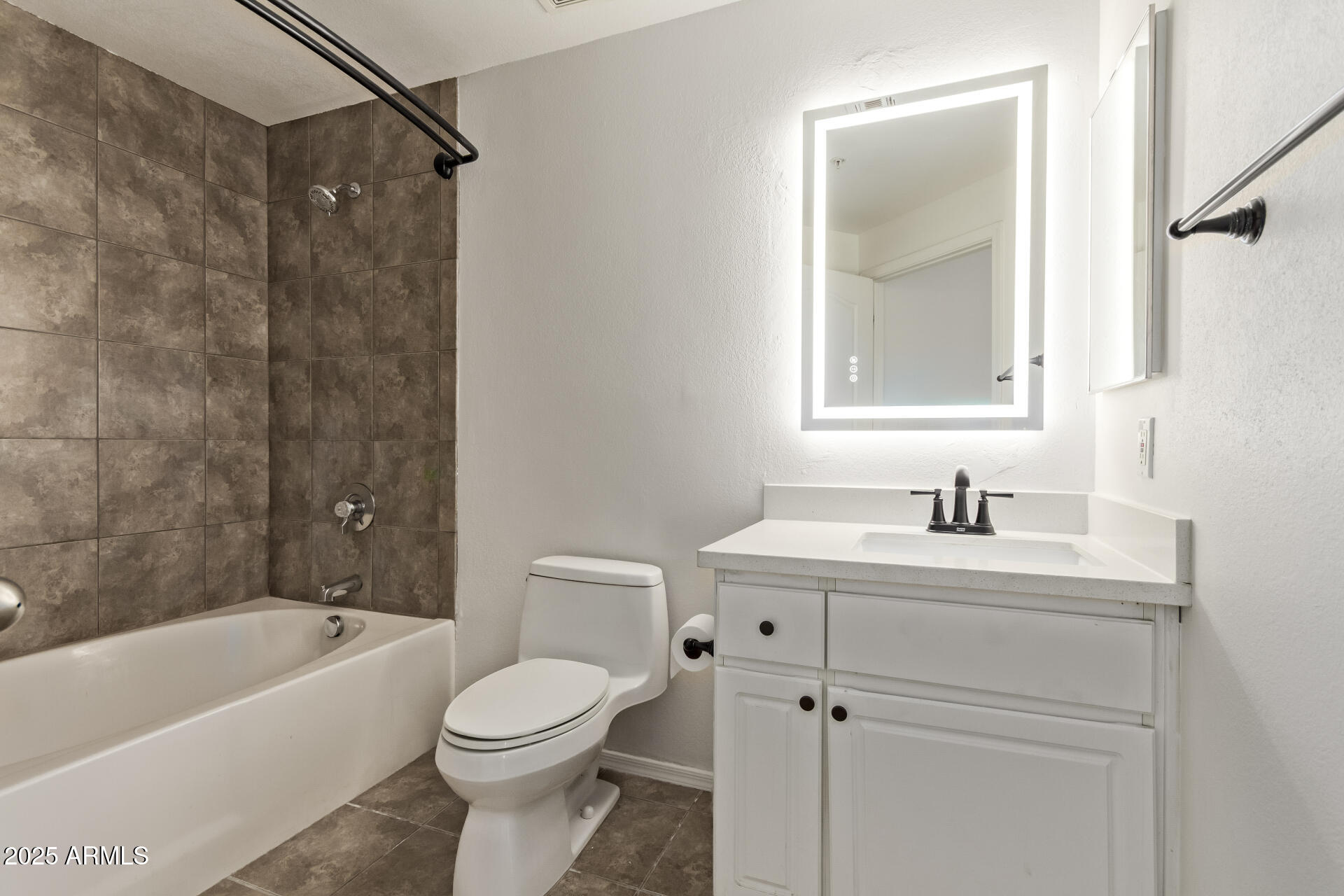 1701 East Colter Street, Unit 191 Phoenix, AZ 85016 - Photo 4 of 33 a bathroom with a sink toilet and shower