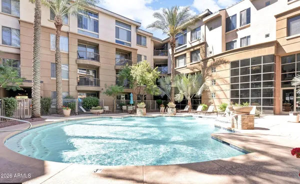 a view of a building with a yard