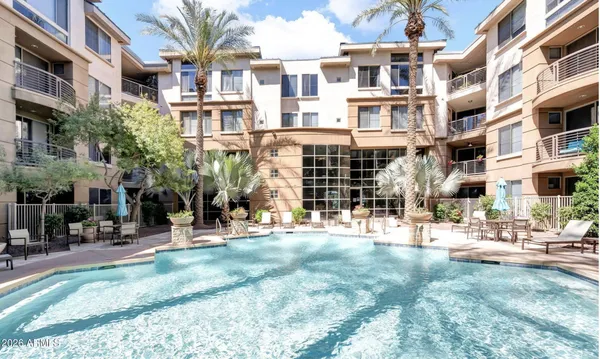 a view of a building with a yard