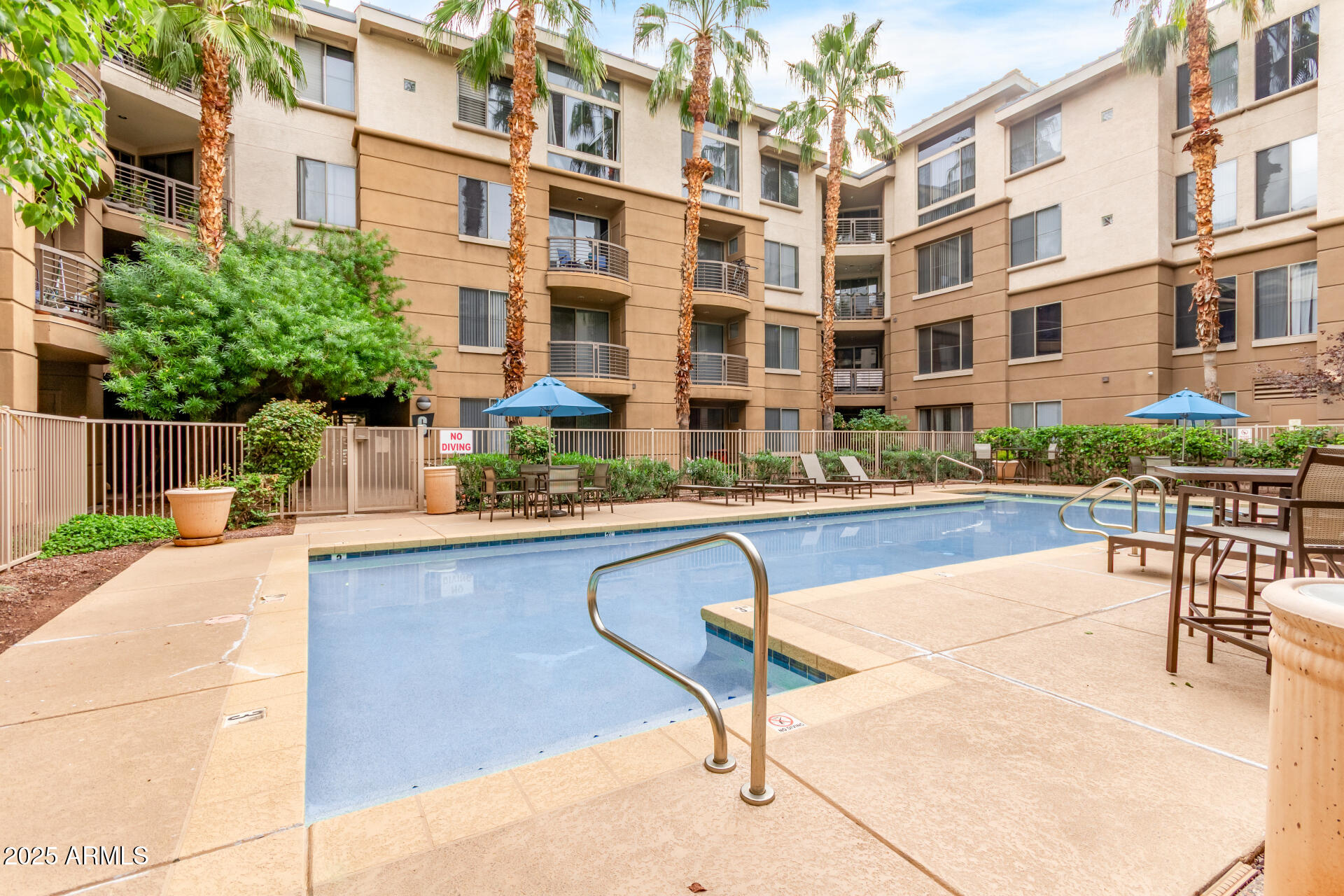 1701 East Colter Street, Unit 191 Phoenix, AZ 85016 - Photo 9 of 33 a swimming pool with outdoor seating and yard
