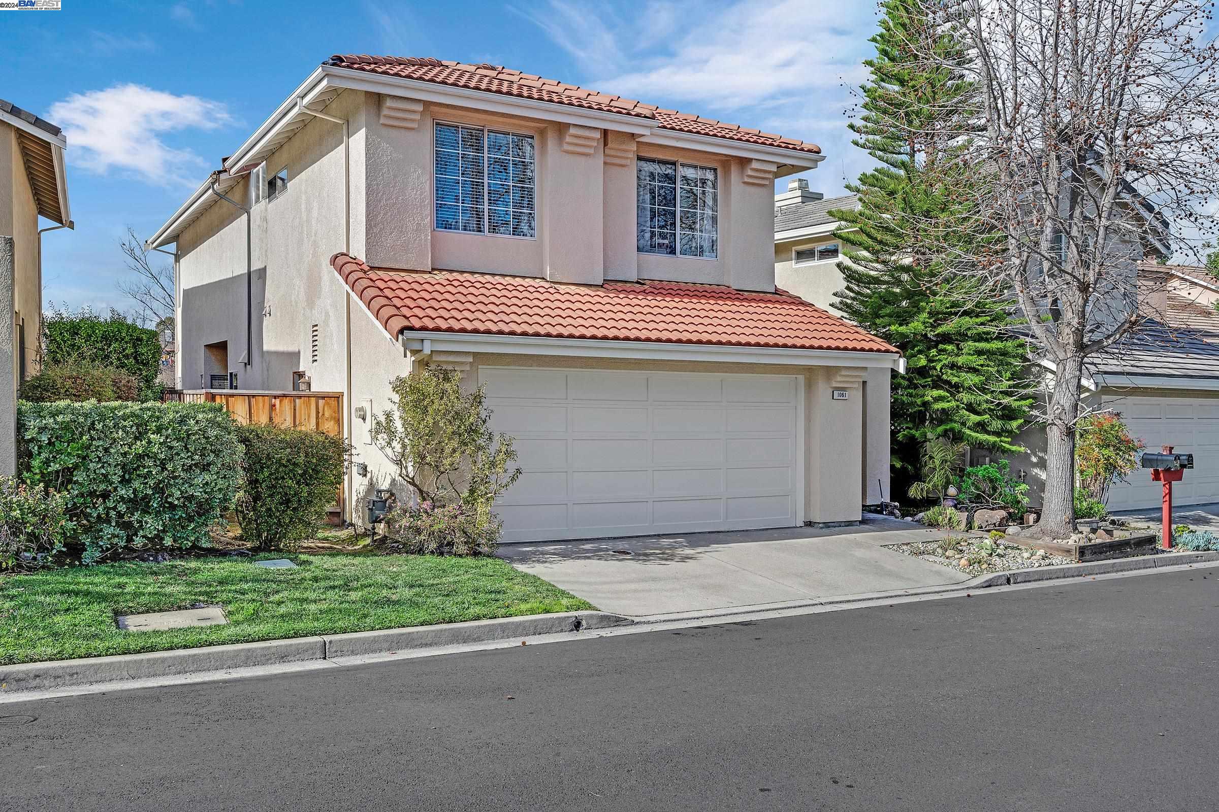 1061 Lakeridge Place San Ramon, CA 94582 - Photo 1 of 1 a front view of a house with a yard and garage