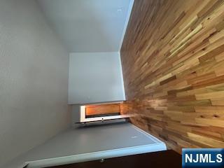 148 Undercliff Avenue, Unit 2 Edgewater, NJ 07020 - Photo 12 of 13 a view of empty room with wooden floor