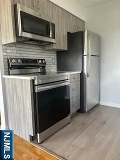 a kitchen with a stove and a microwave