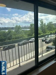 a view of a balcony with furniture