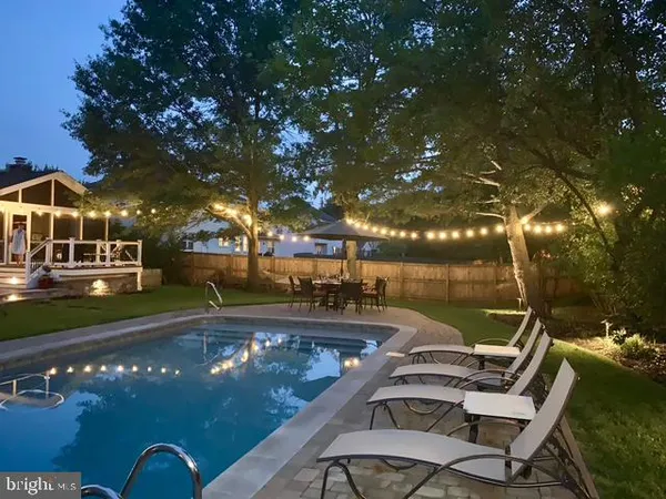 a view of a swimming pool with a patio