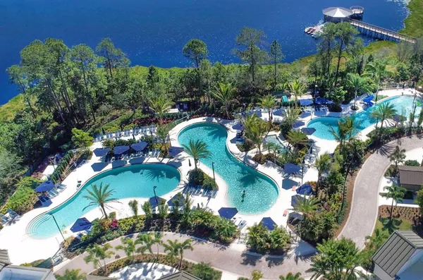 an aerial view of a residential houses with outdoor space and street view