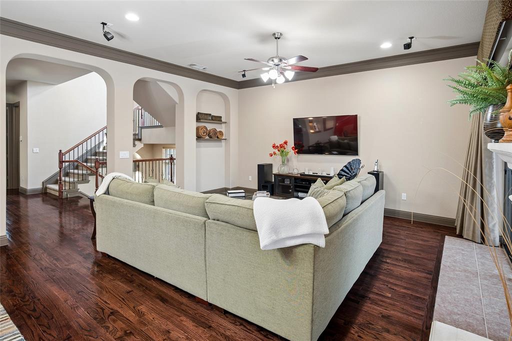 835 Rockingham Drive Irving, TX 75063 - Photo 9 of 27 a living room with furniture and a flat screen tv