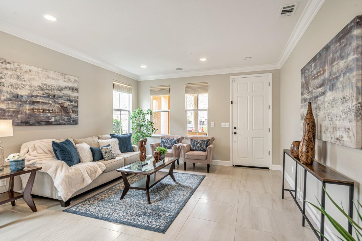 6525 Gravina Loop San Jose, CA 95138 - Photo 11 of 63 a living room with furniture wooden floor and a flat screen tv