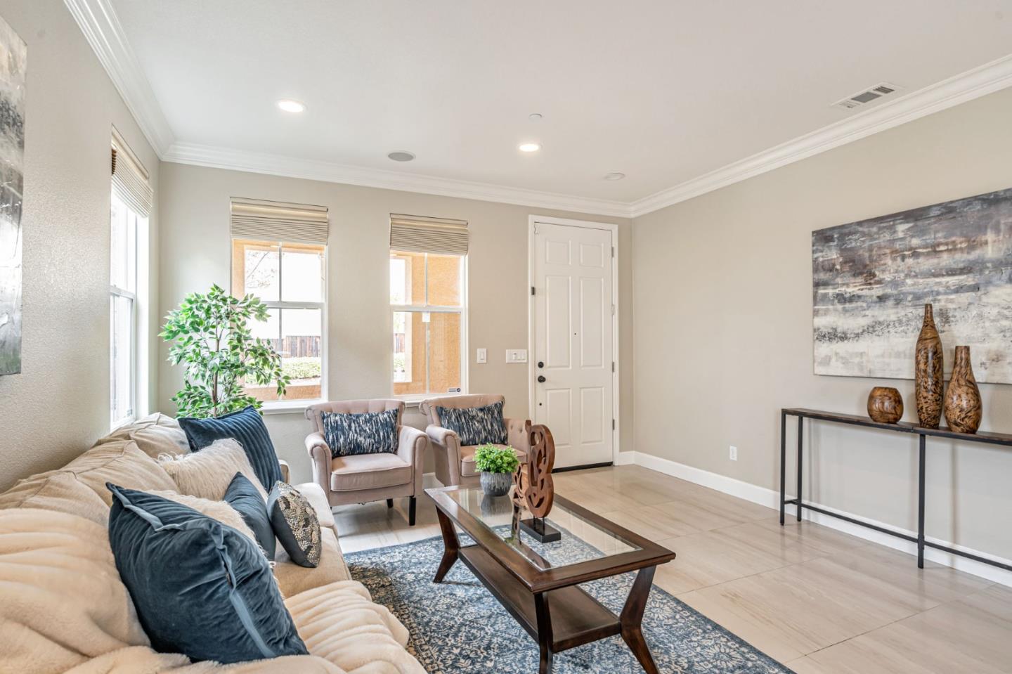 6525 Gravina Loop San Jose, CA 95138 - Photo 12 of 63 a living room with furniture and a potted plant