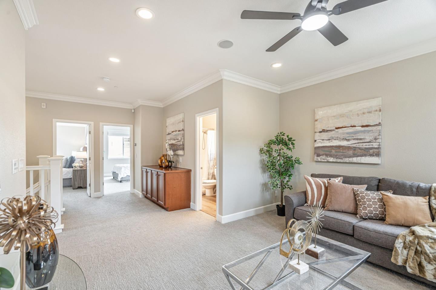 6525 Gravina Loop San Jose, CA 95138 - Photo 15 of 63 a living room with furniture and a chandelier