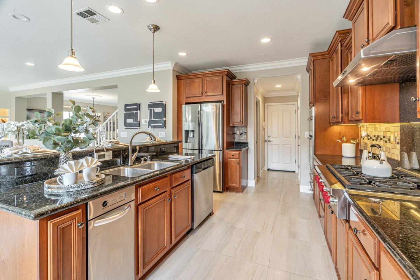 6525 Gravina Loop San Jose, CA 95138 - Photo 21 of 63 a kitchen with sink stove and cabinets