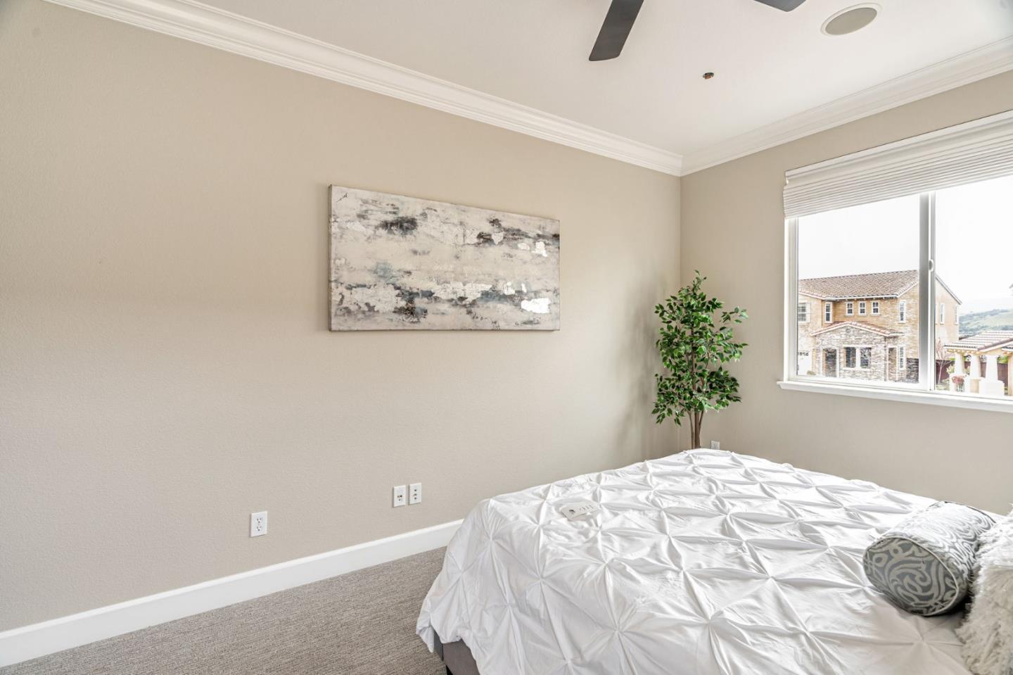 6525 Gravina Loop San Jose, CA 95138 - Photo 31 of 63 a bedroom with a bed and a window