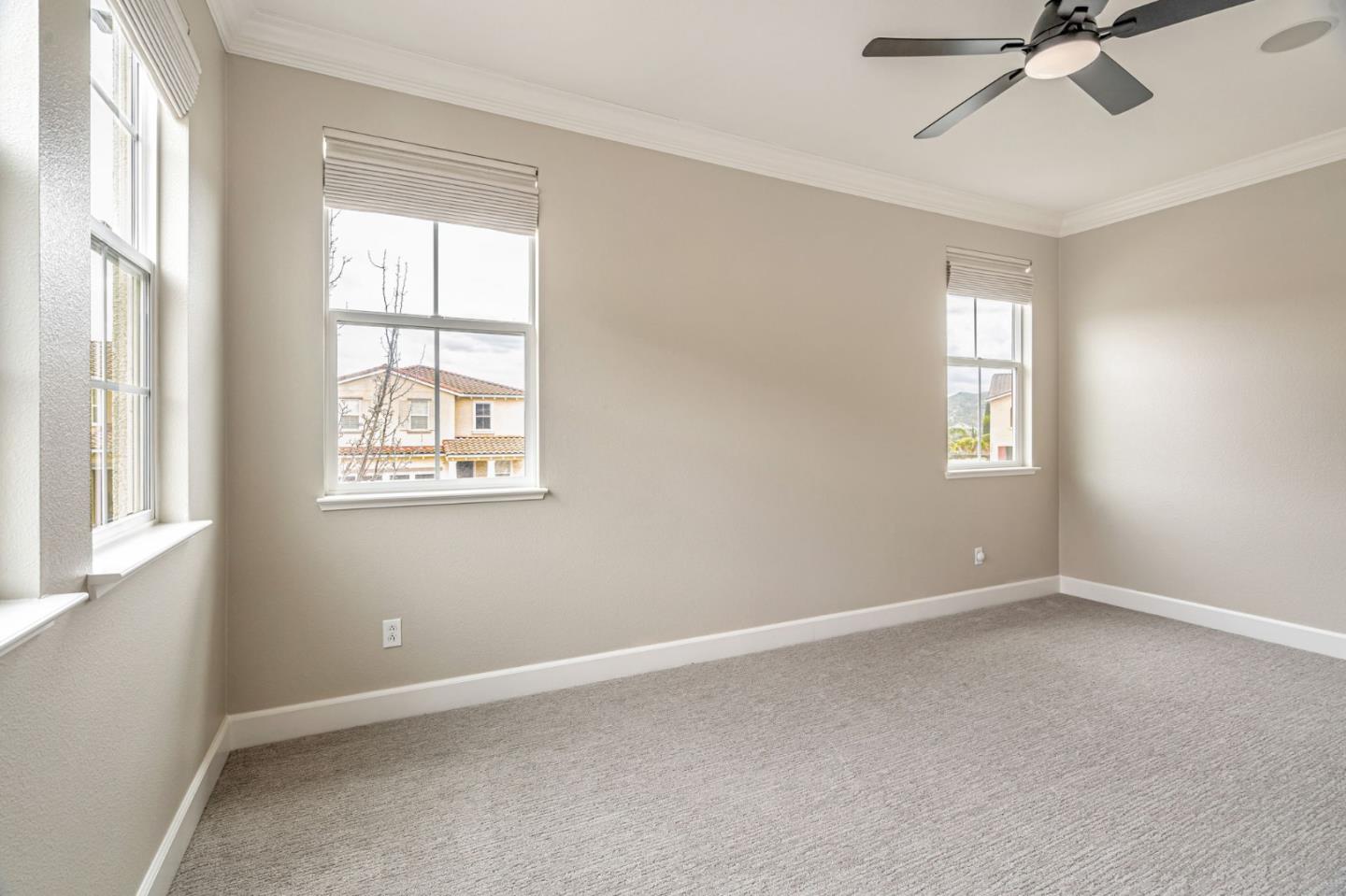 6525 Gravina Loop San Jose, CA 95138 - Photo 34 of 63 an empty room with a window and a fan