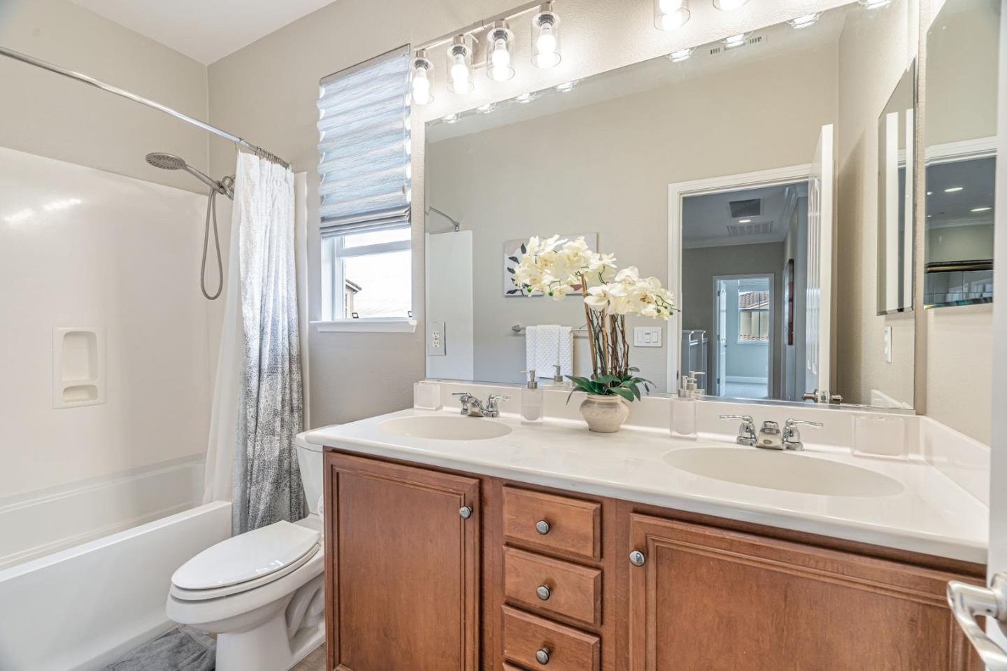 6525 Gravina Loop San Jose, CA 95138 - Photo 40 of 63 a bathroom with a granite countertop sink toilet and shower