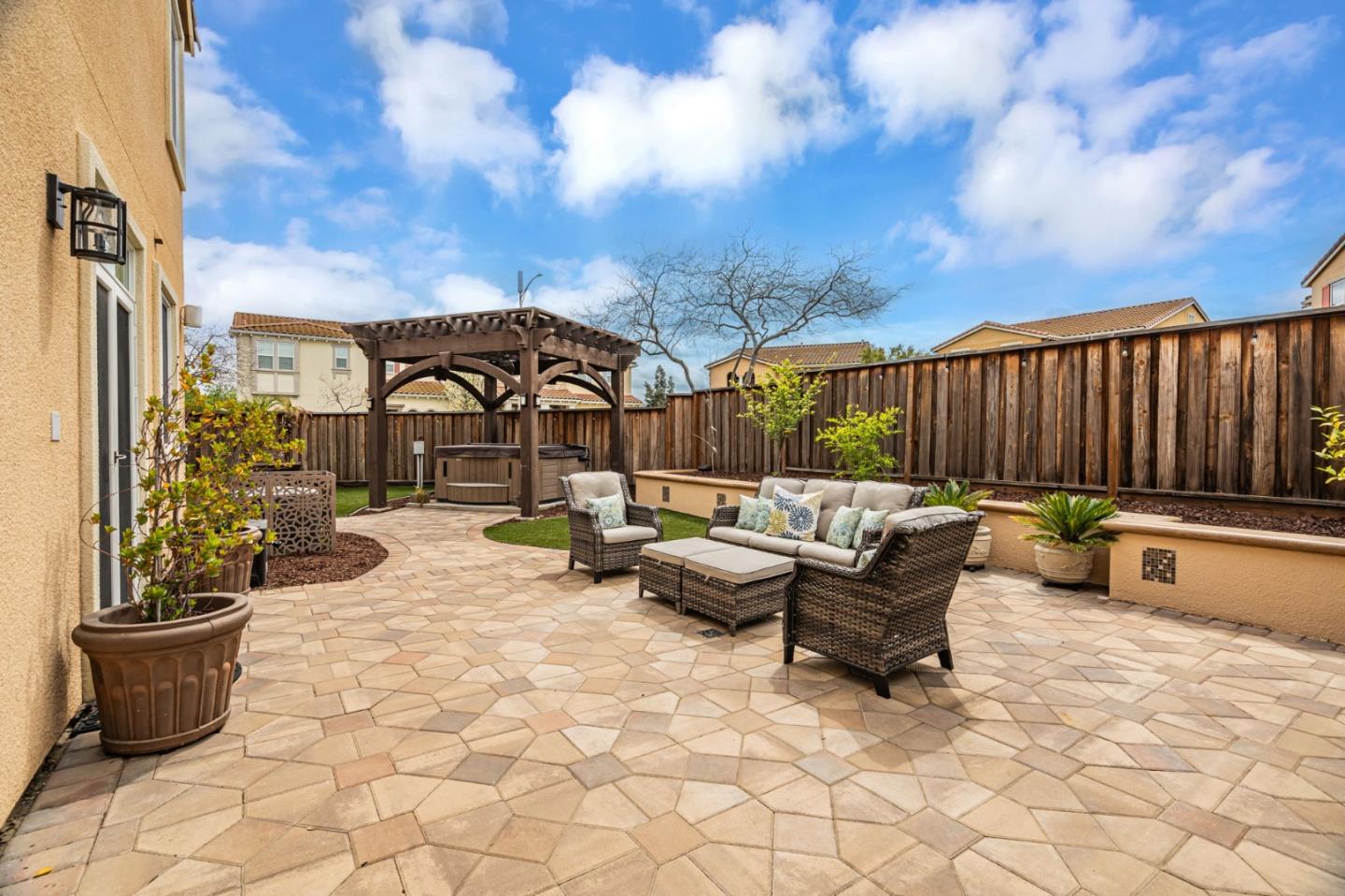6525 Gravina Loop San Jose, CA 95138 - Photo 43 of 63 a backyard of a house with fire pit and barbeque oven