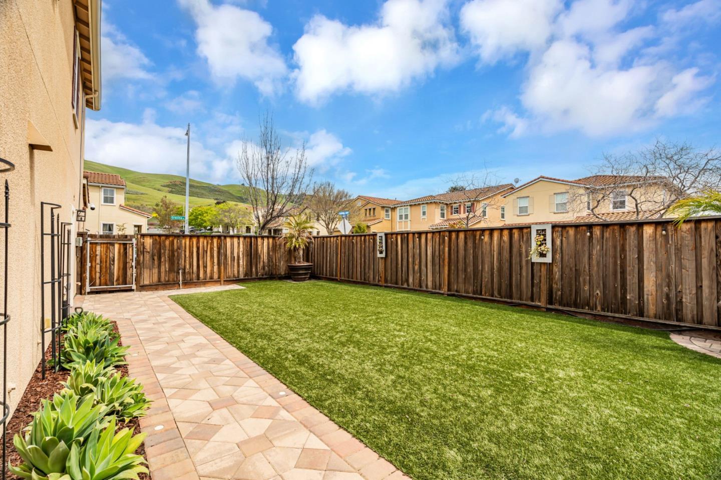 6525 Gravina Loop San Jose, CA 95138 - Photo 48 of 63 a view of a backyard with brick wall