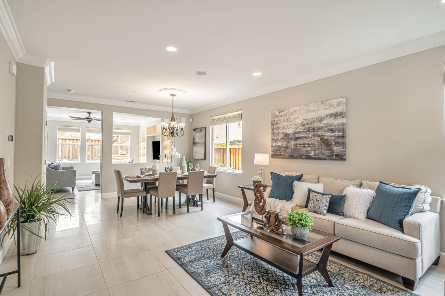 6525 Gravina Loop San Jose, CA 95138 - Photo 10 of 63 a living room with furniture potted plant and kitchen view