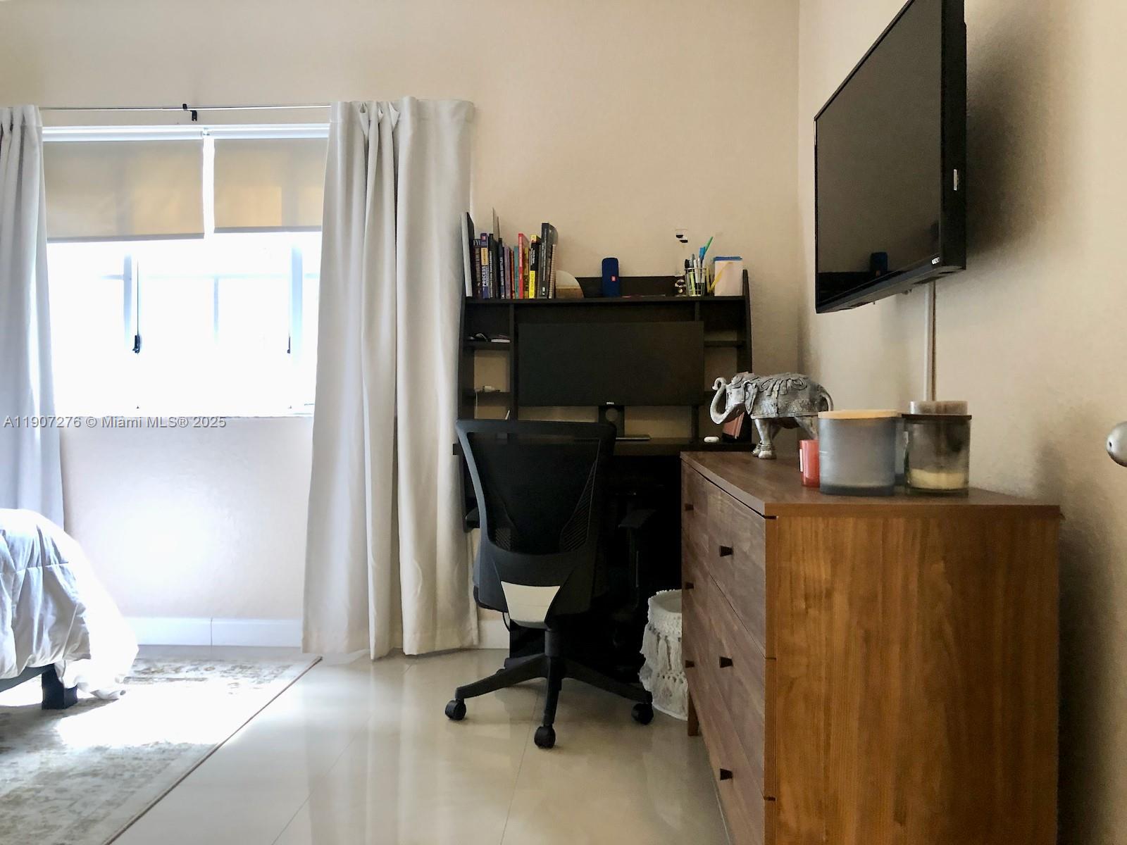 2532 Centergate Drive, Unit 102 Miramar, FL 33025 - Photo 25 of 58 a view of a workspace with furniture