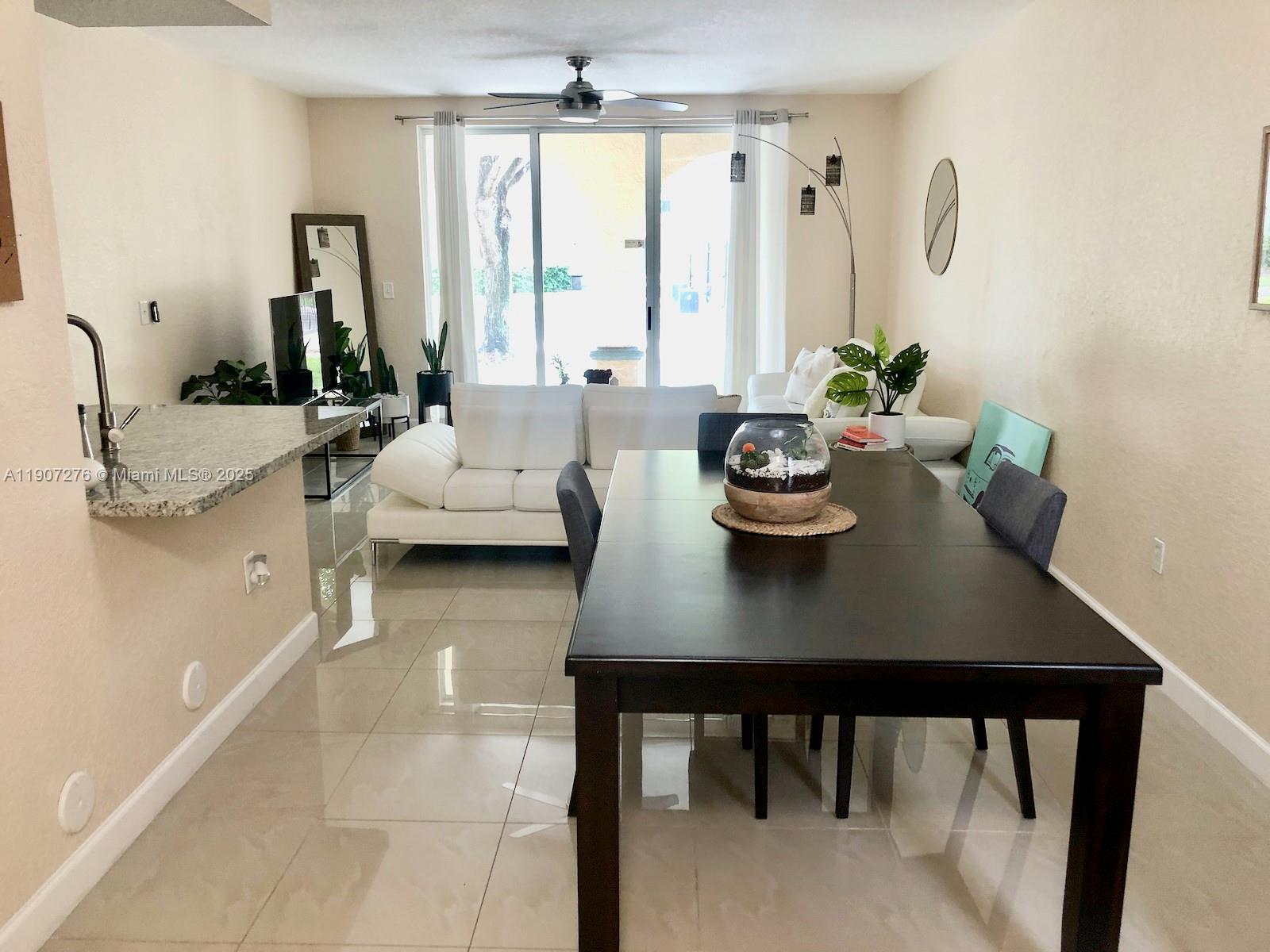 2532 Centergate Drive, Unit 102 Miramar, FL 33025 - Photo 3 of 58 a view of a dining room with furniture and window