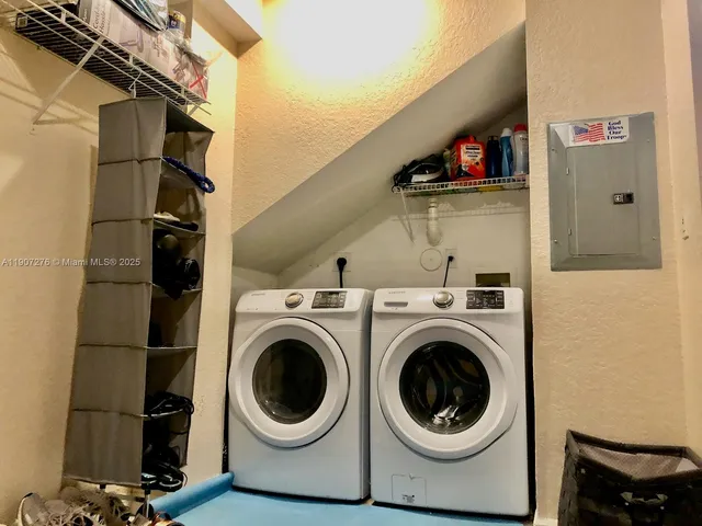 a view of a fountain in front of a house with a big yard