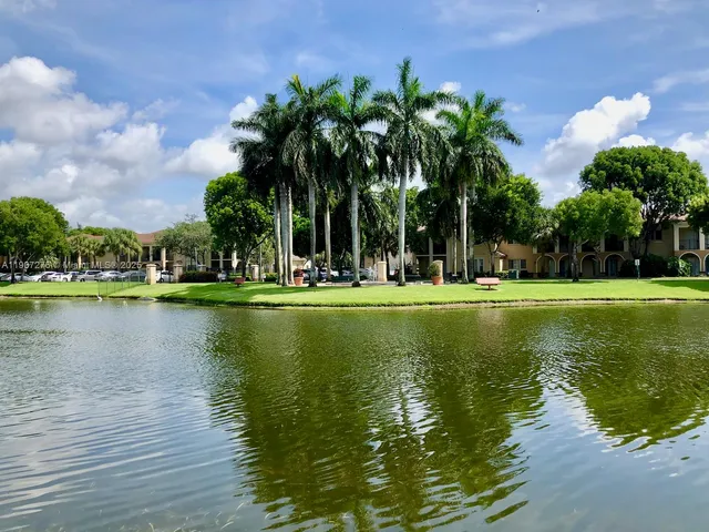 a view of lake with green space