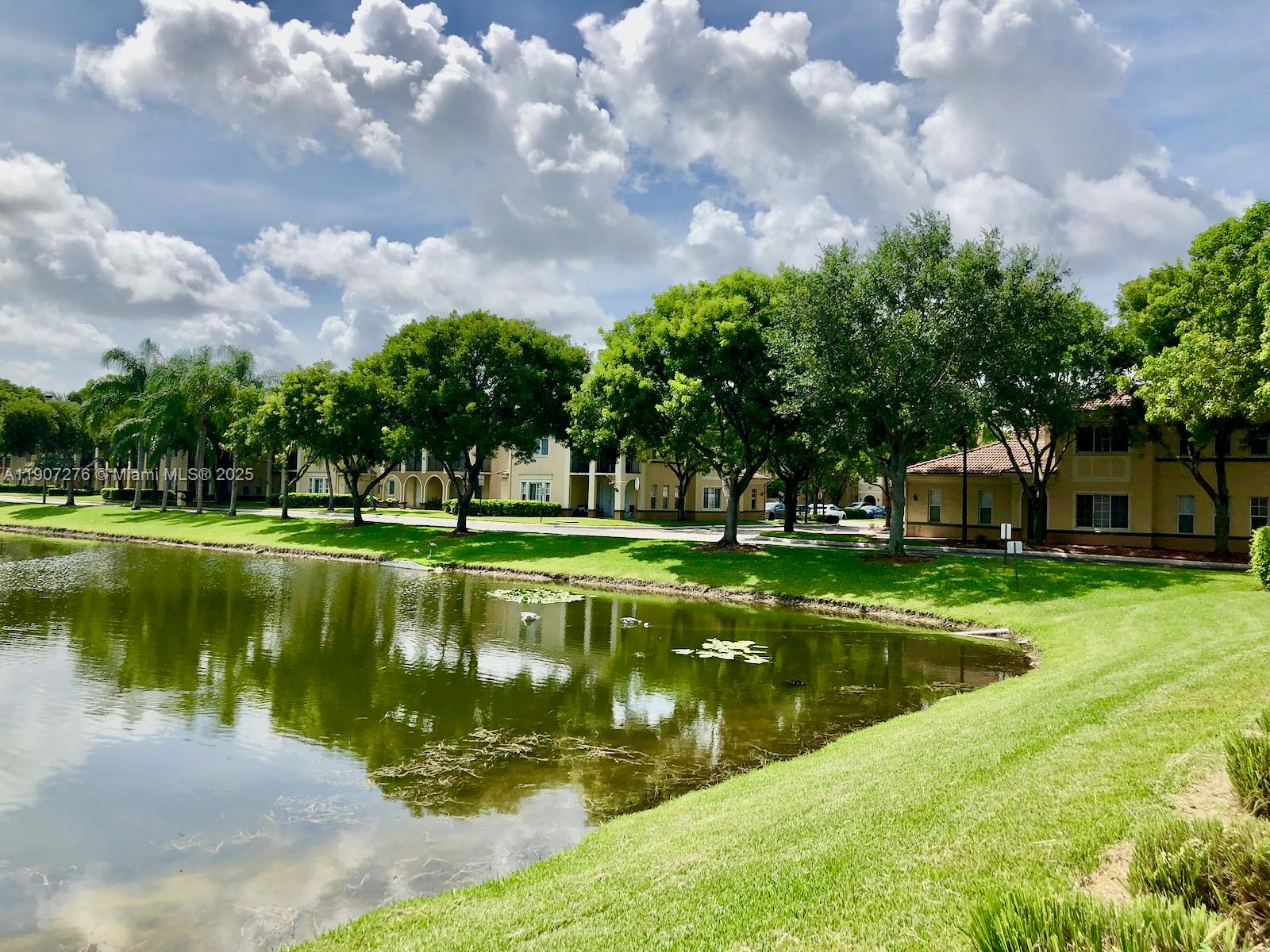 2532 Centergate Drive, Unit 102 Miramar, FL 33025 - Photo 35 of 58 a view of a fountain in front of a house with a big yard