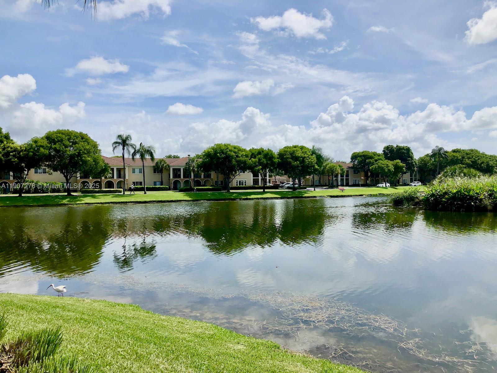 2532 Centergate Drive, Unit 102 Miramar, FL 33025 - Photo 37 of 58 a view of a lake with a city