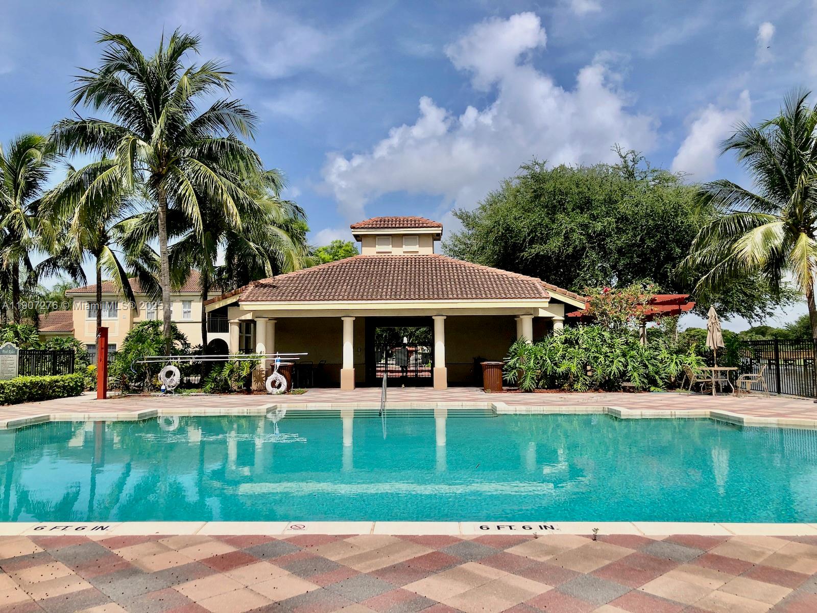 2532 Centergate Drive, Unit 102 Miramar, FL 33025 - Photo 43 of 58 a front view of a house with a yard