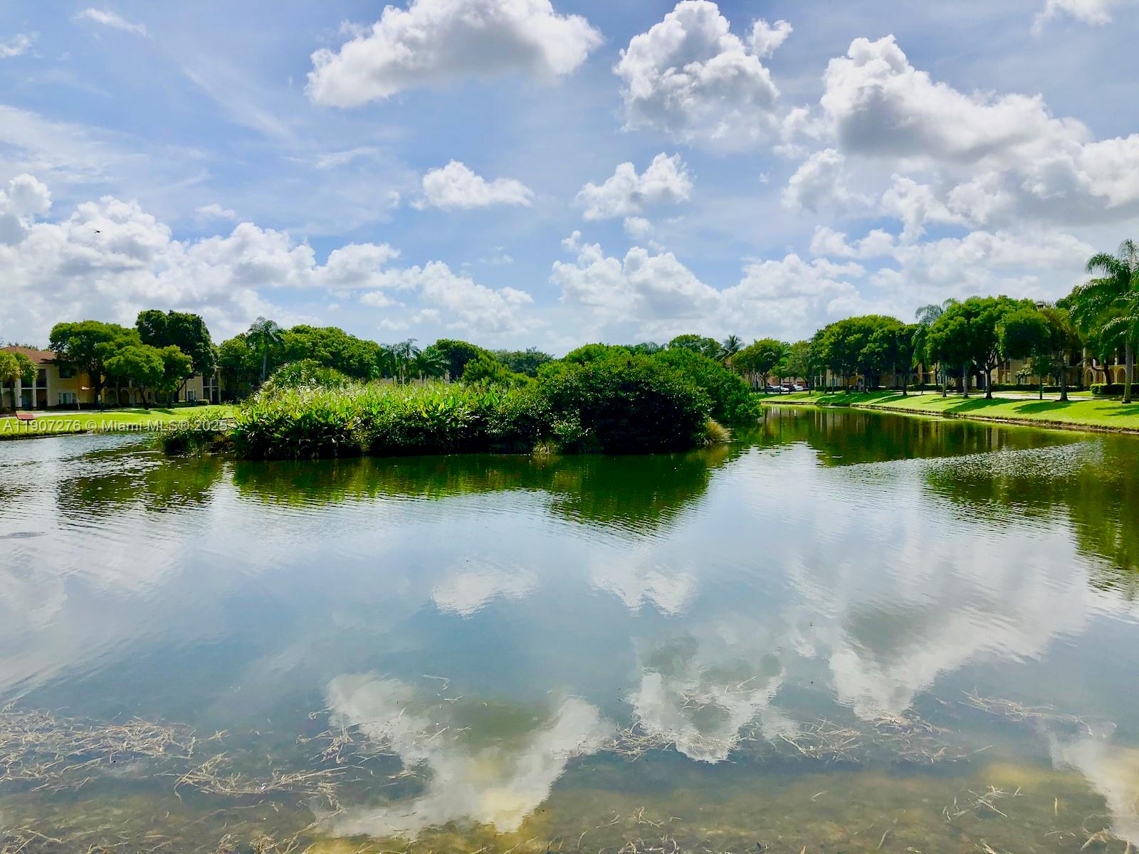 2532 Centergate Drive, Unit 102 Miramar, FL 33025 - Photo 57 of 58 a view of a lake with a yard