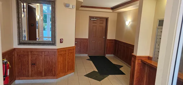 a view of closet with mirror