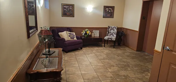a living room with furniture and a window