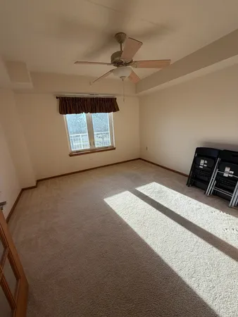 a view of an empty room and a window
