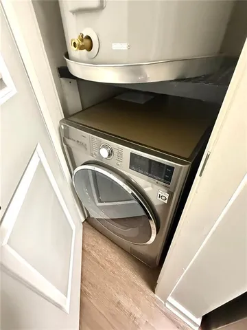 a close view of sink and washer dryer