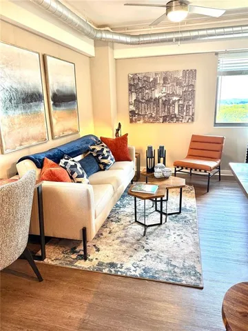 a living room with a couch and a window