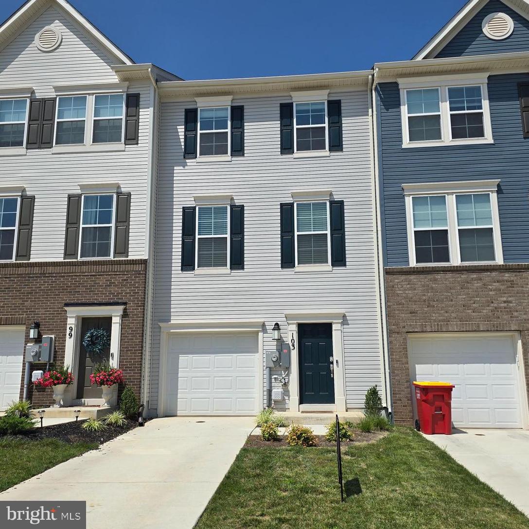 103 Winterplace Drive Charles Town, WV 25414 - Photo 1 of 20 a backyard of a house with yard and brick wall