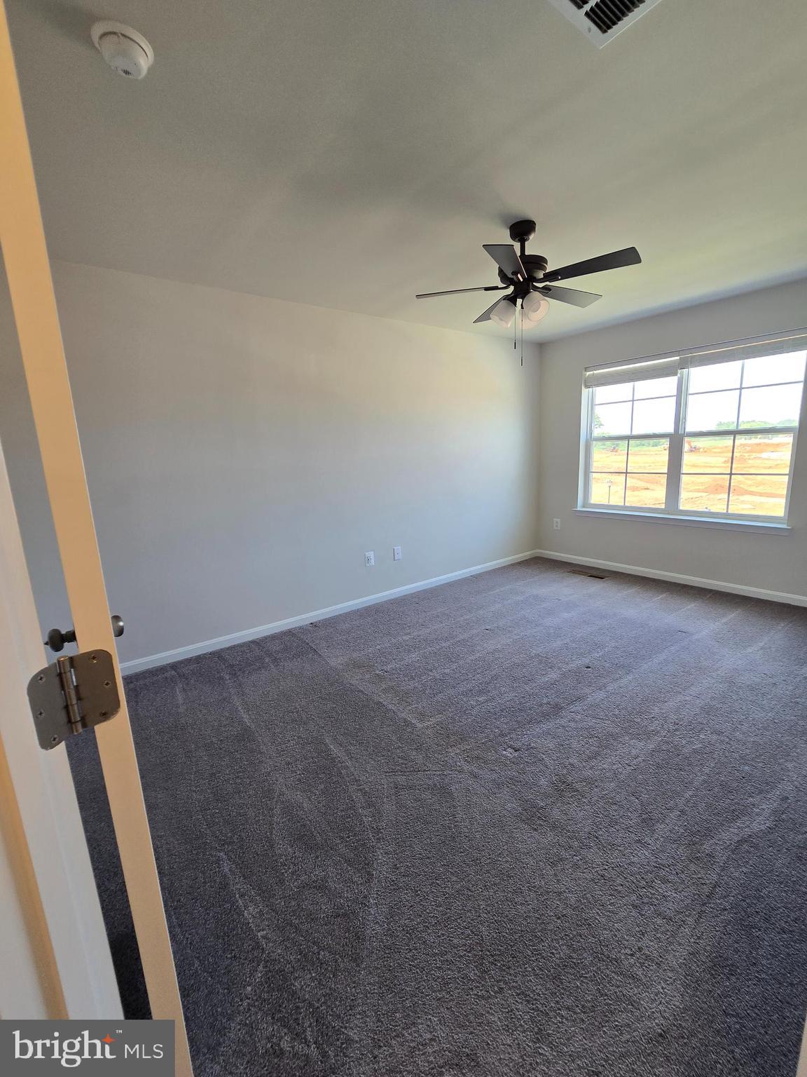103 Winterplace Drive Charles Town, WV 25414 - Photo 12 of 20 an empty room with windows and fan
