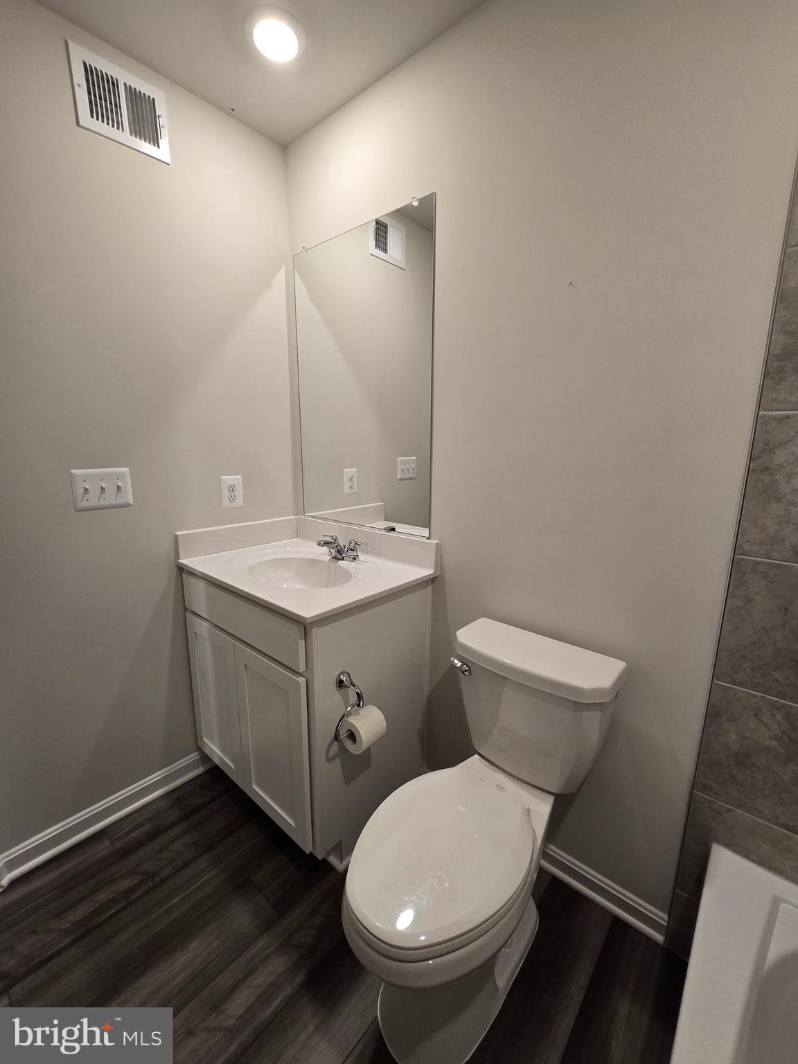 103 Winterplace Drive Charles Town, WV 25414 - Photo 16 of 20 a bathroom with a toilet sink and mirror