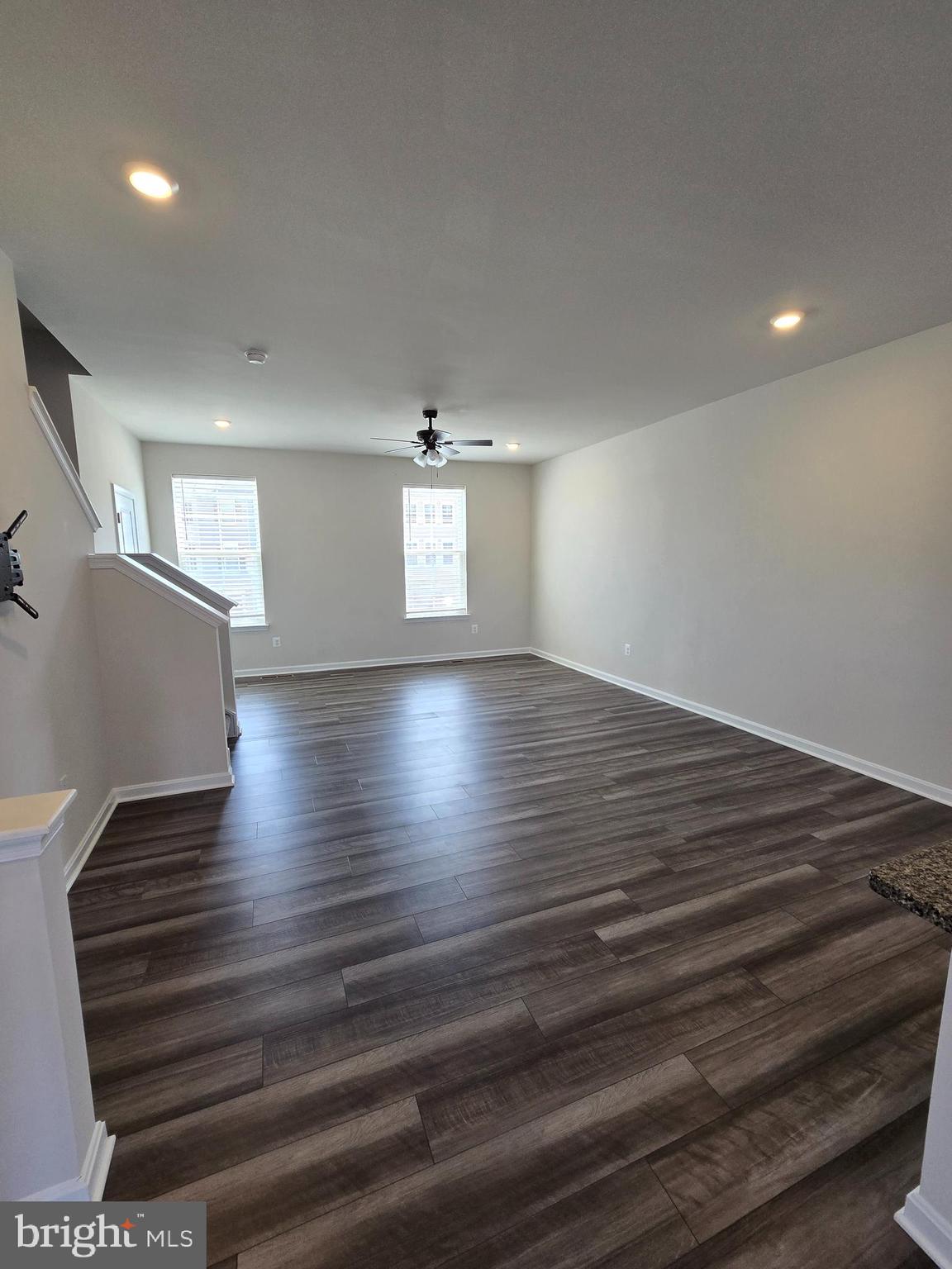 103 Winterplace Drive Charles Town, WV 25414 - Photo 5 of 20 an empty room with wooden floor and windows