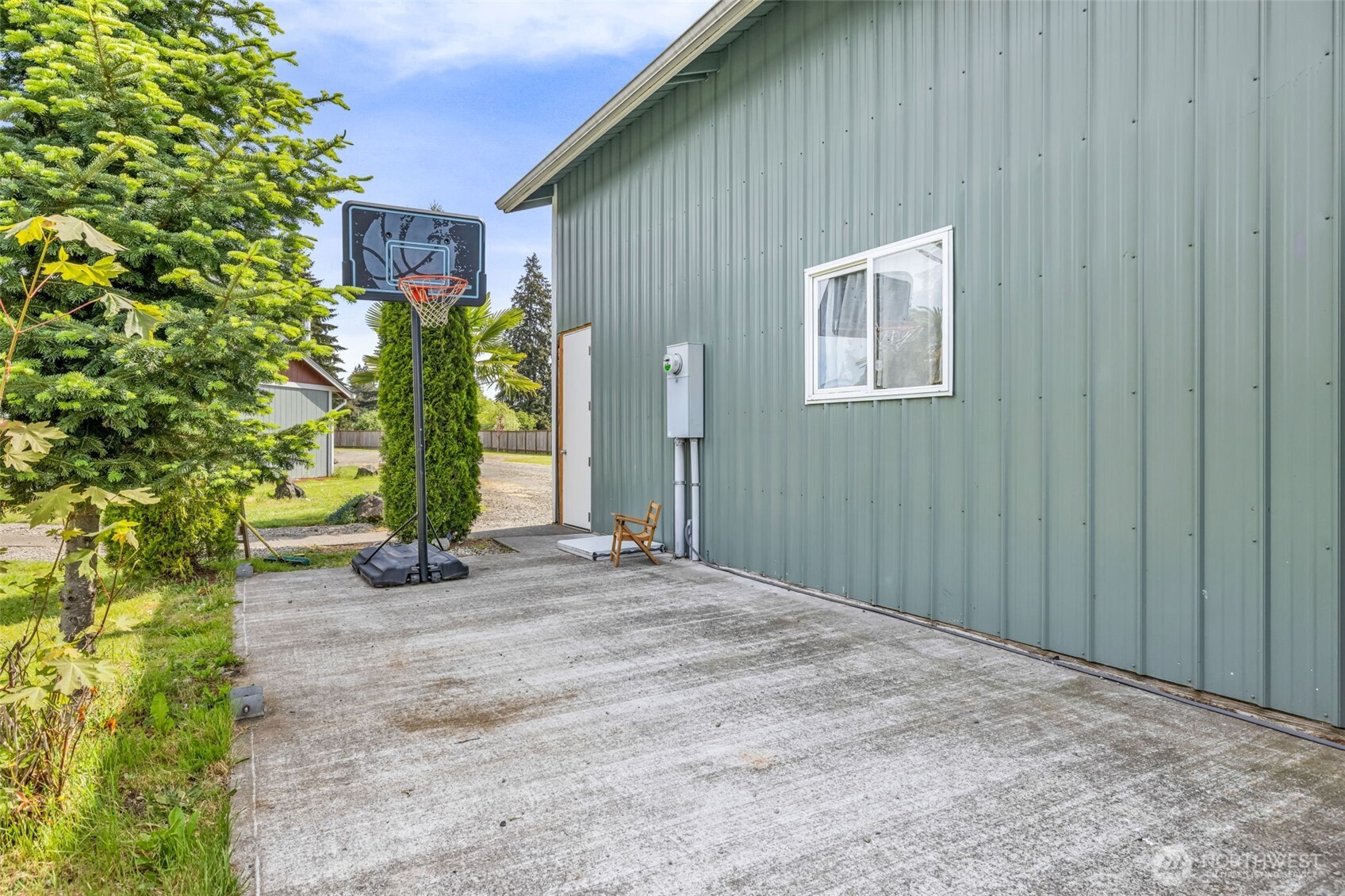 10313 School Land Road Southwest Rochester, WA 98579 - Photo 38 of 40 a front view of a house with a yard and plant