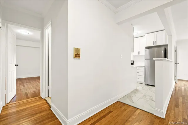 a view of a kitchen with wooden floor