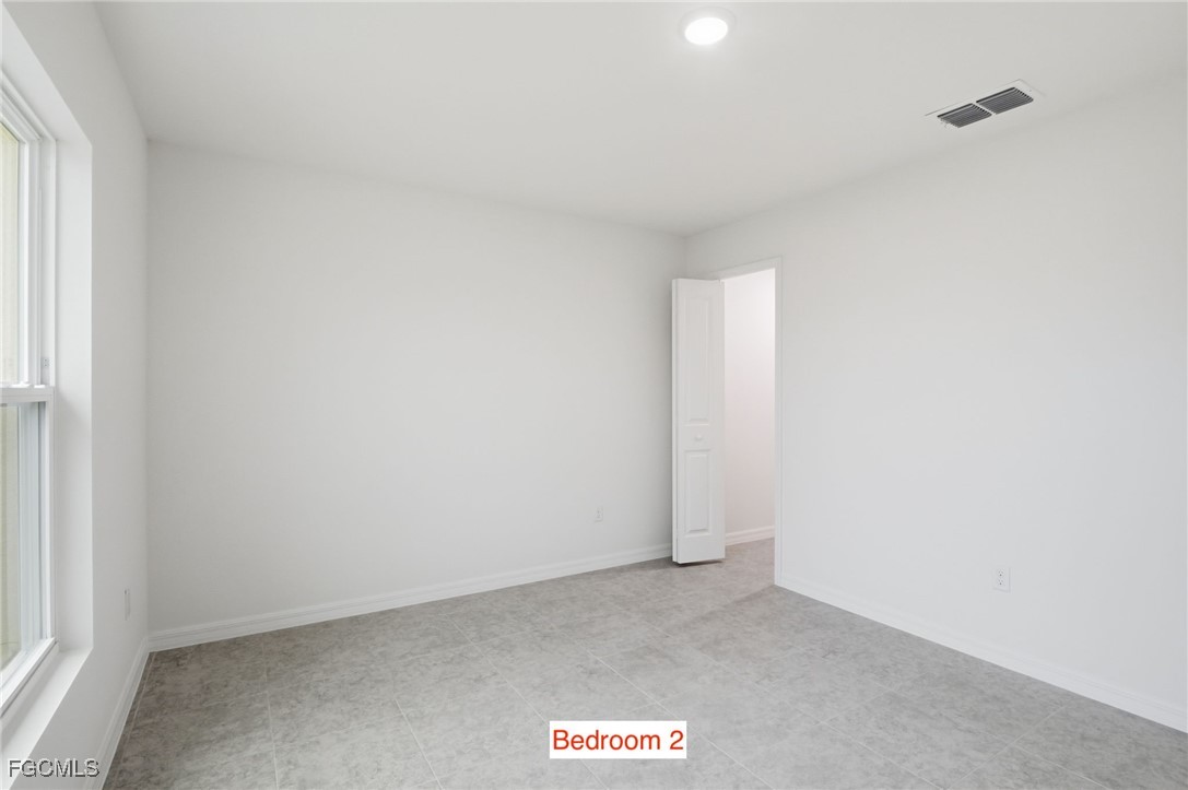 3418 20th Street Southwest Lehigh Acres, FL 33976 - Photo 21 of 34 a view of an empty room