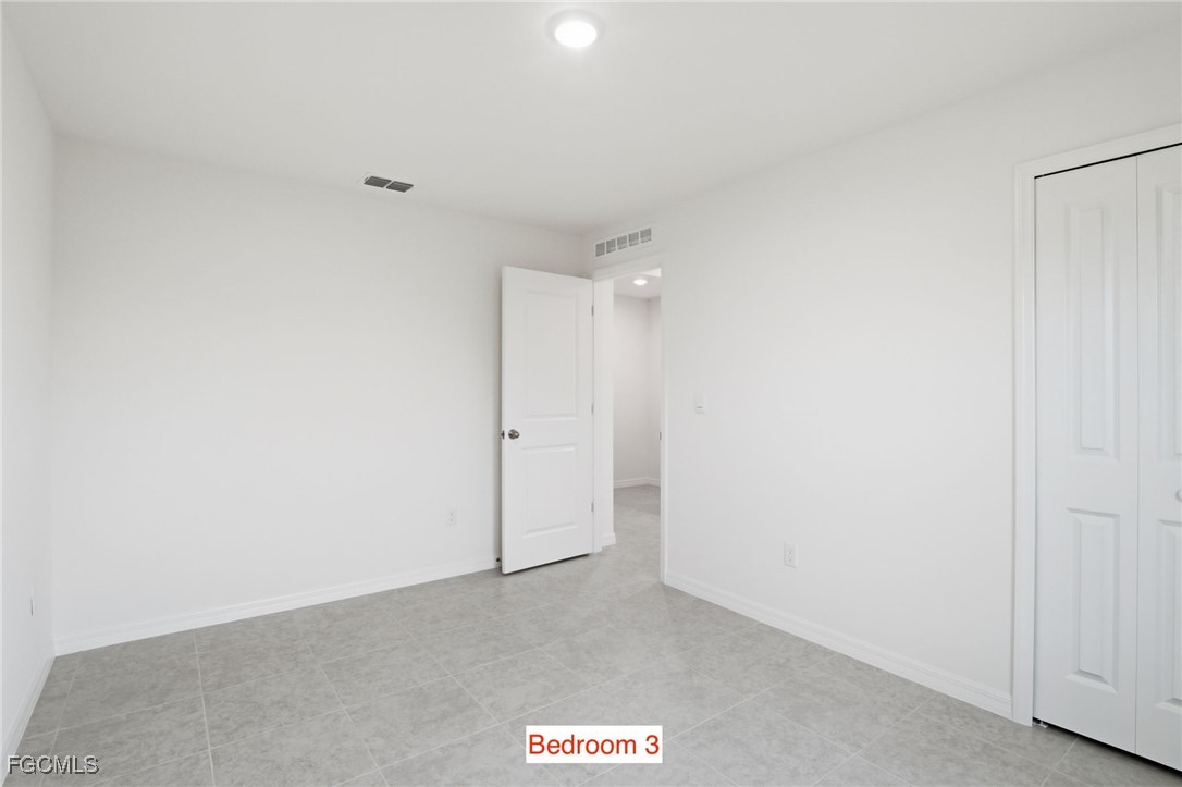 3418 20th Street Southwest Lehigh Acres, FL 33976 - Photo 26 of 34 a view of an empty room
