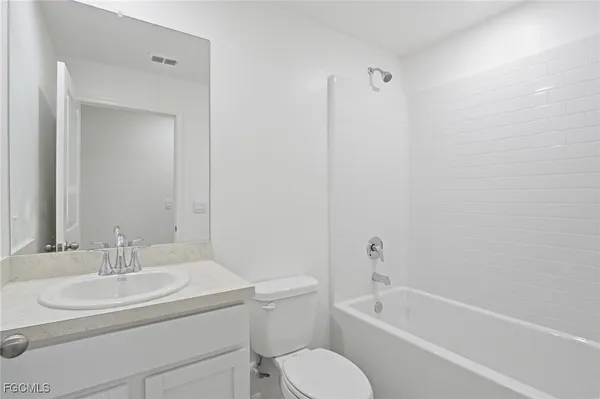 a bathroom with a sink toilet and bathtub