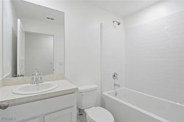 a bathroom with a sink toilet and bathtub