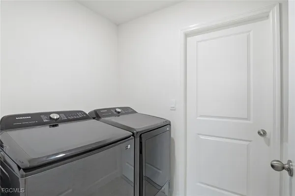 a utility room with dryer and washer